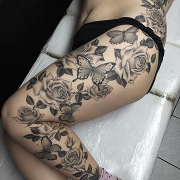 tatuajes de mariposas en la pierna con rosas