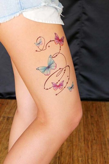 tatuajes femeninos en la pierna de mariposas