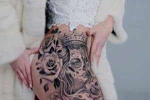 tatuajes de catrinas con rosas en la pierna