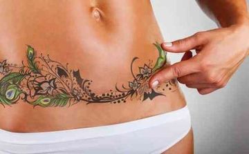 tatuajes que cubren cicatrices en el abdomen
