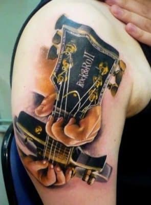 tatuajes de guitarras para mujer grandes