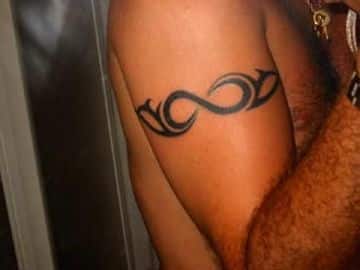 tatuajes de infinito para hombres tipo tribal