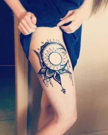 tatuajes de sol y luna en la pierna