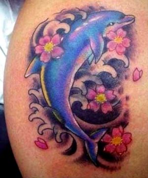 tatuajes de delfines en 3d entre flores