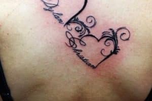 tatuajes de corazones con letras grandes compromiso