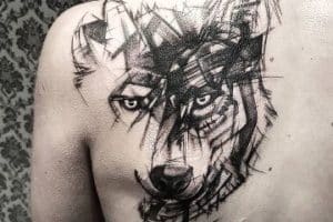 tatuajes de lobos en la espalda tipo trash polka