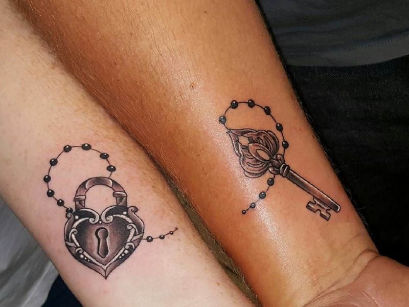 tatuajes corazon y llave union