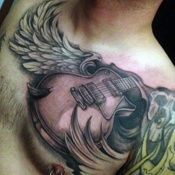 tatuajes de notas musicales con alas instrumentos