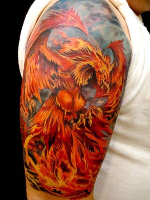 tatuajes en el brazo ave fenix a colores