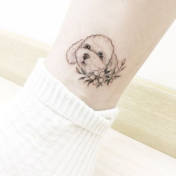 tattoo de cachorros delicados con toques fotograficos