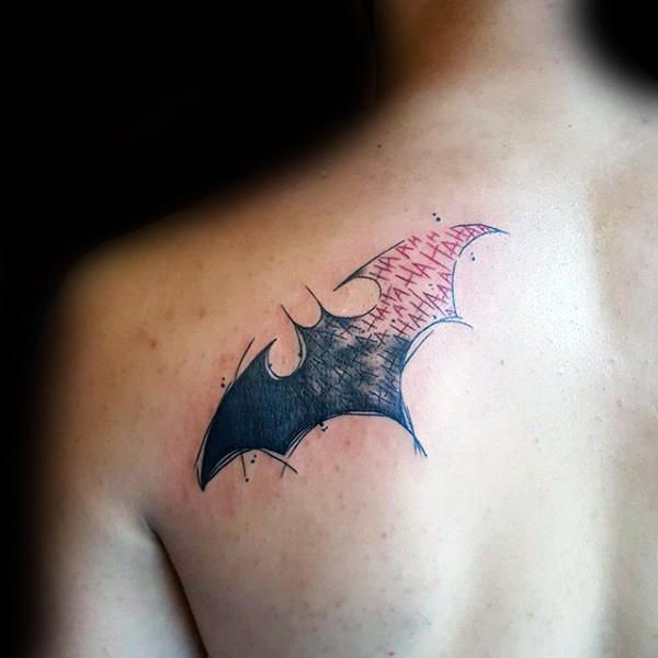tatuajes de batman y joker en espalda
