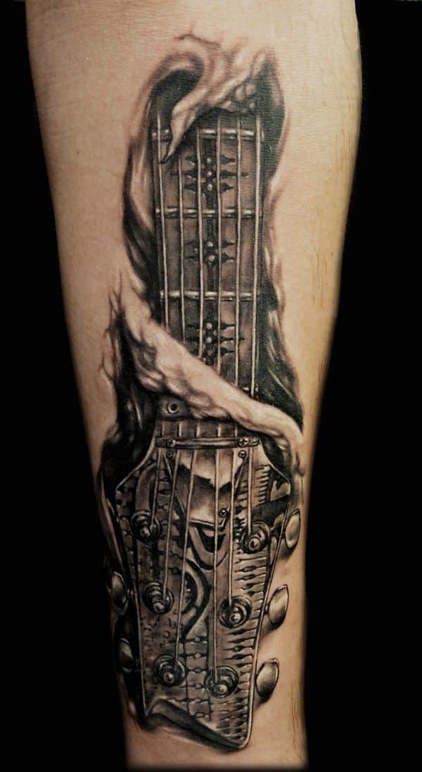 tatuajes de rock and roll guitarra piel desgarrada